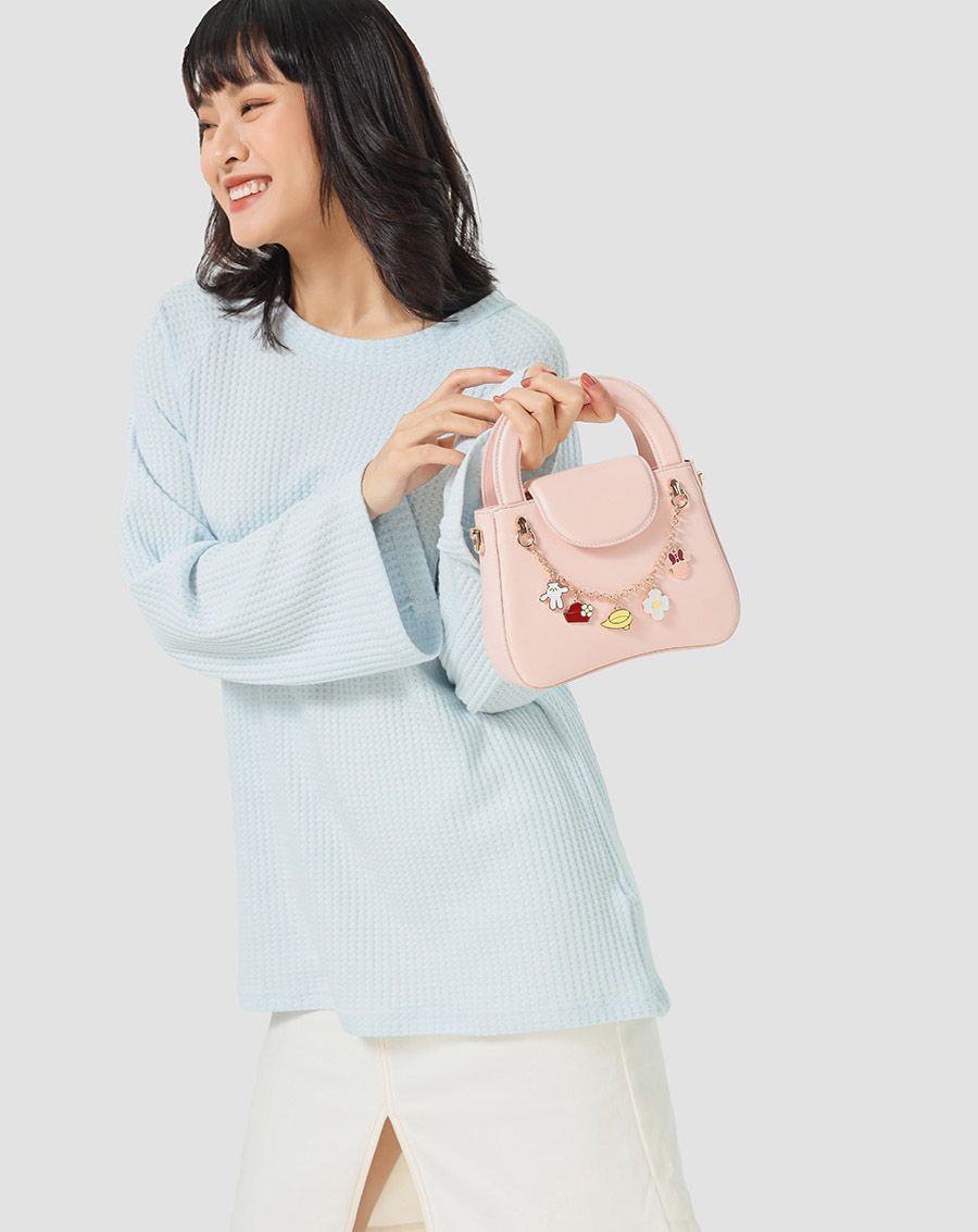 Túi xách nhỏ Minnie gắn charm minnie