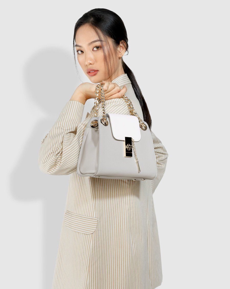 Túi xách nhỏ satchel cách điệu khóa gài