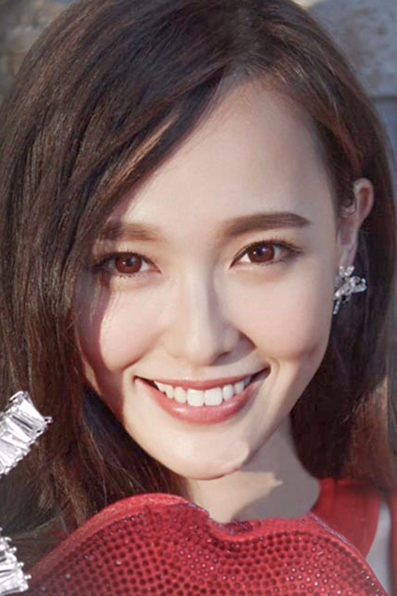 BÔNG TAI HÌNH NƠ XOẮN PHA LÊ (AC)