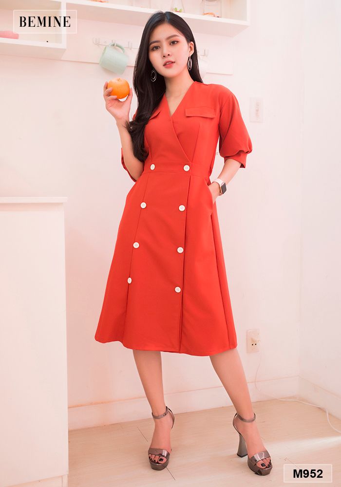 M952CAM - Đầm cam đính nút trắng lớn thun eo