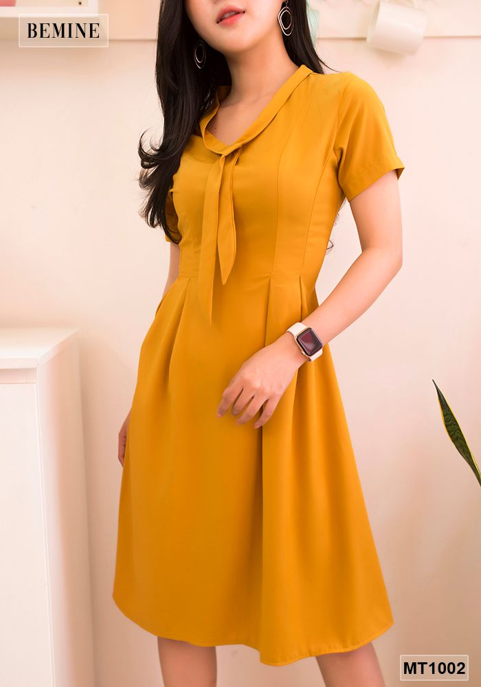 MT1002VANG - Đầm vàng tùng xoè cột dây nơ cổ