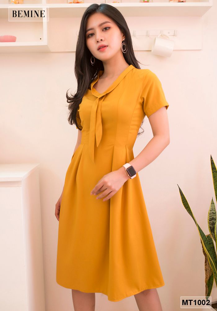 MT1002VANG - Đầm vàng tùng xoè cột dây nơ cổ