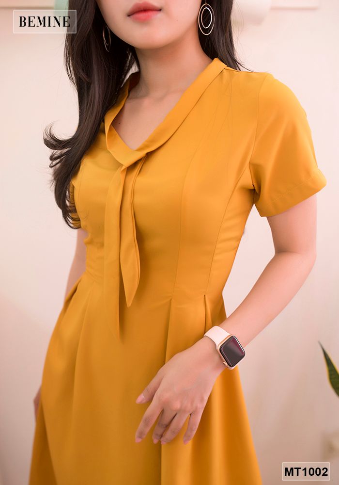 MT1002VANG - Đầm vàng tùng xoè cột dây nơ cổ