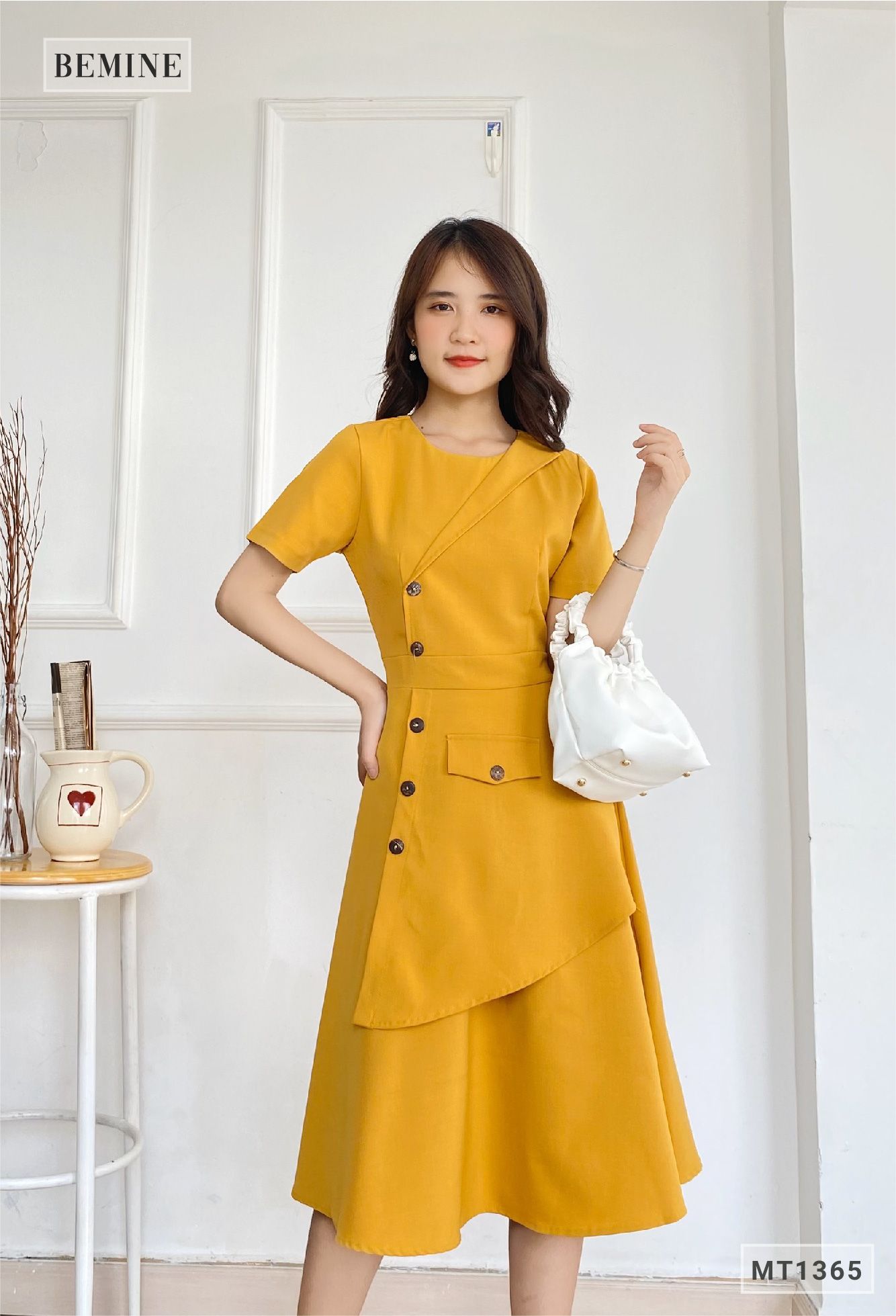 MT1365VANG - Đầm vạt xéo đính nút