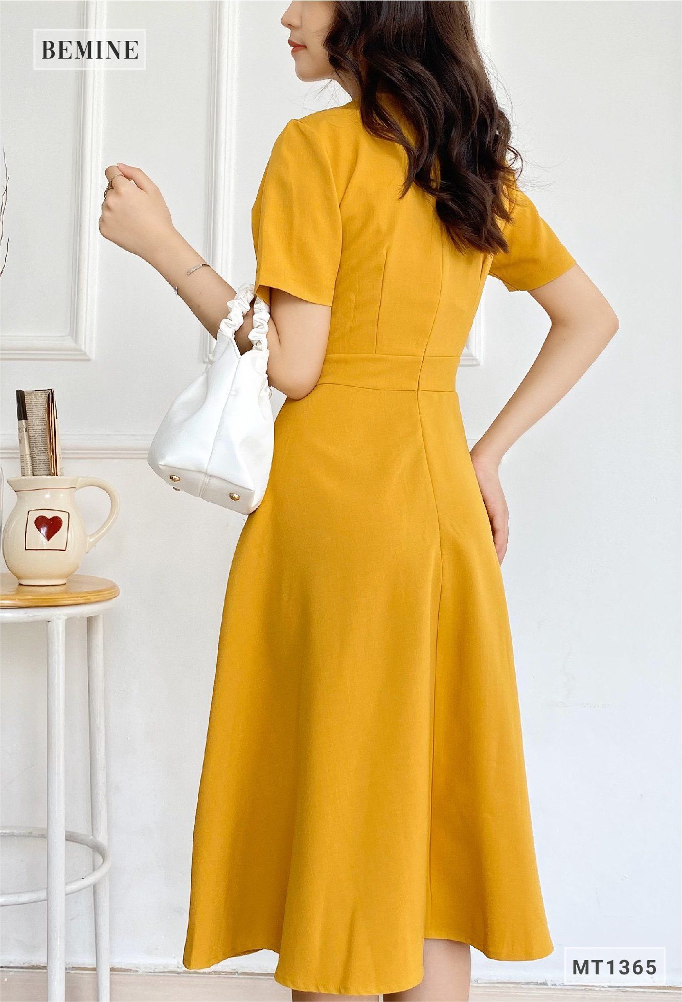 MT1365VANG - Đầm vạt xéo đính nút