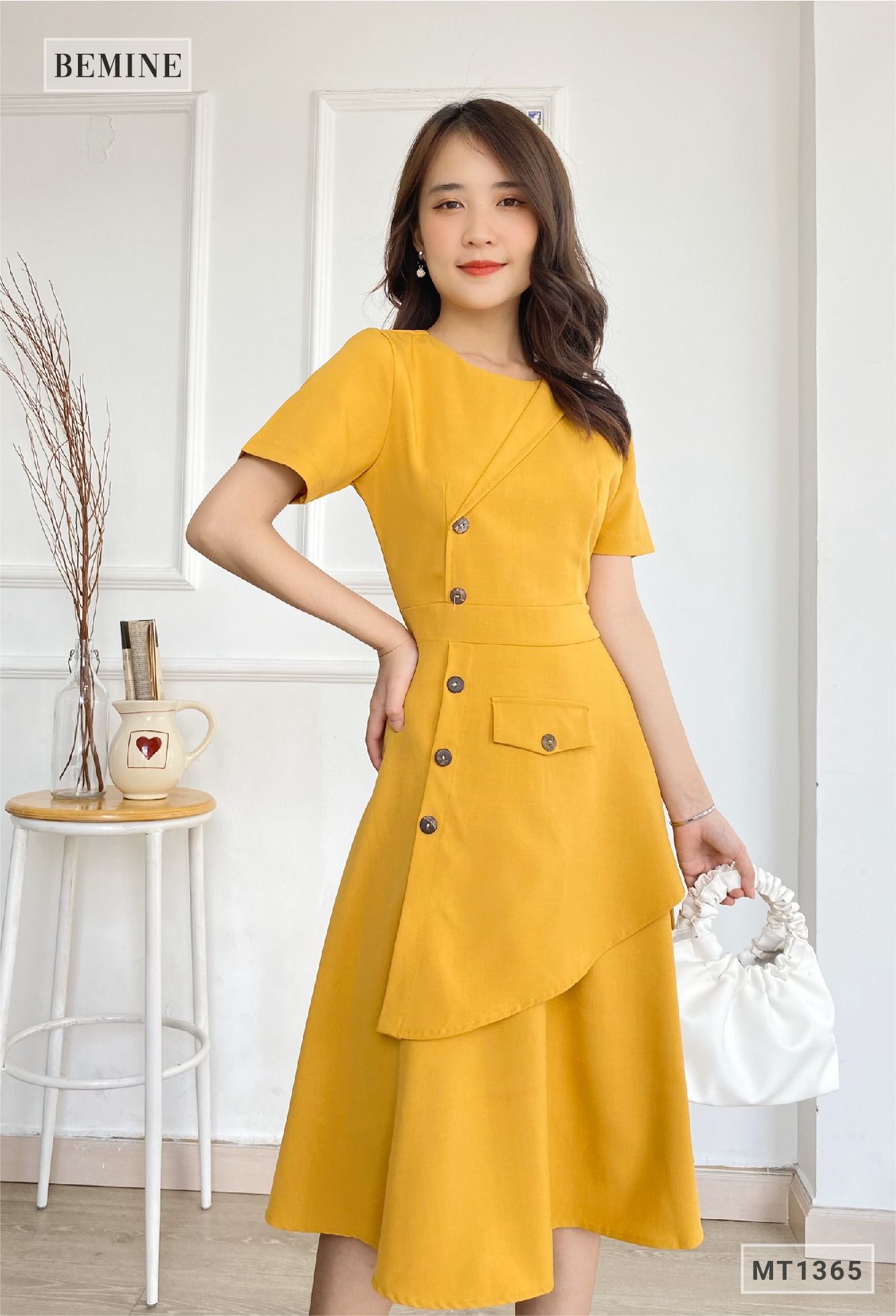 MT1365VANG - Đầm vạt xéo đính nút