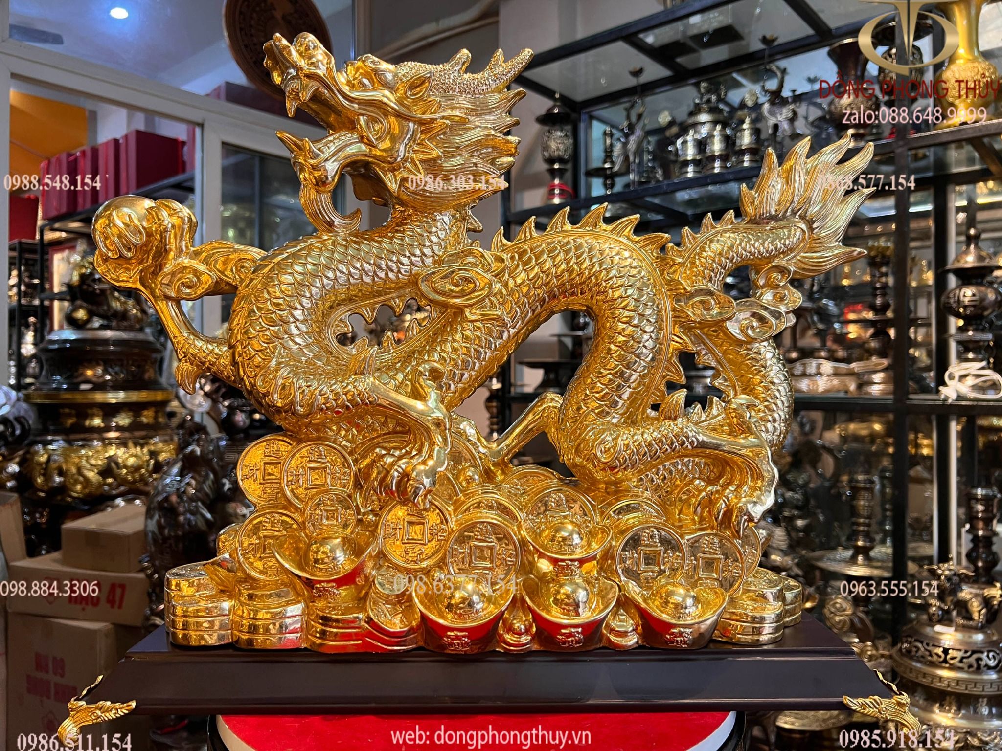 Tượng rồng đế tiền dát vàng 24k