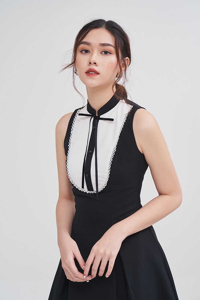 Đầm sát nách phối màu rã ngực cột ribbon
