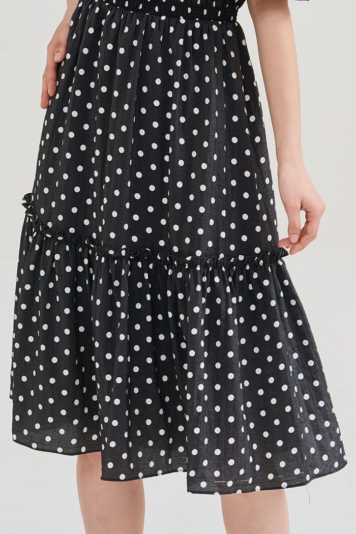 Đầm linen chấm bi midi rã tùng nhún thun
