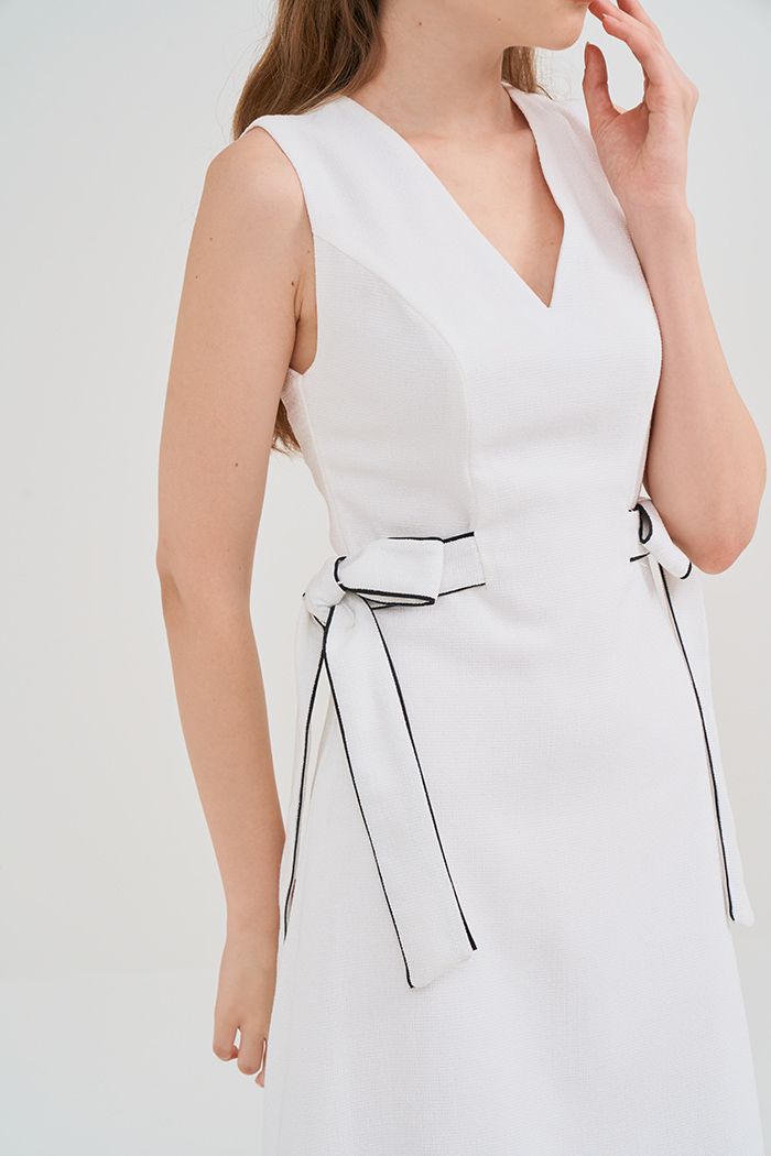 Đầm bố dệt chỉ thắt nơ em cổ tim