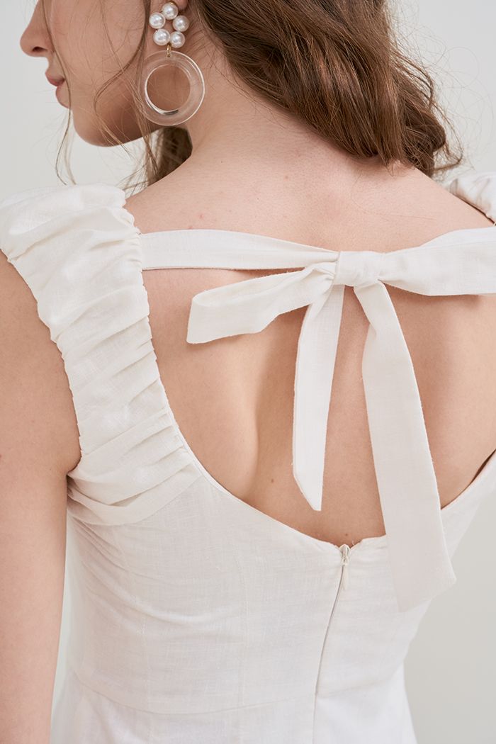 Đầm rã cúp ngực tùng xoè cột nơ lưng
