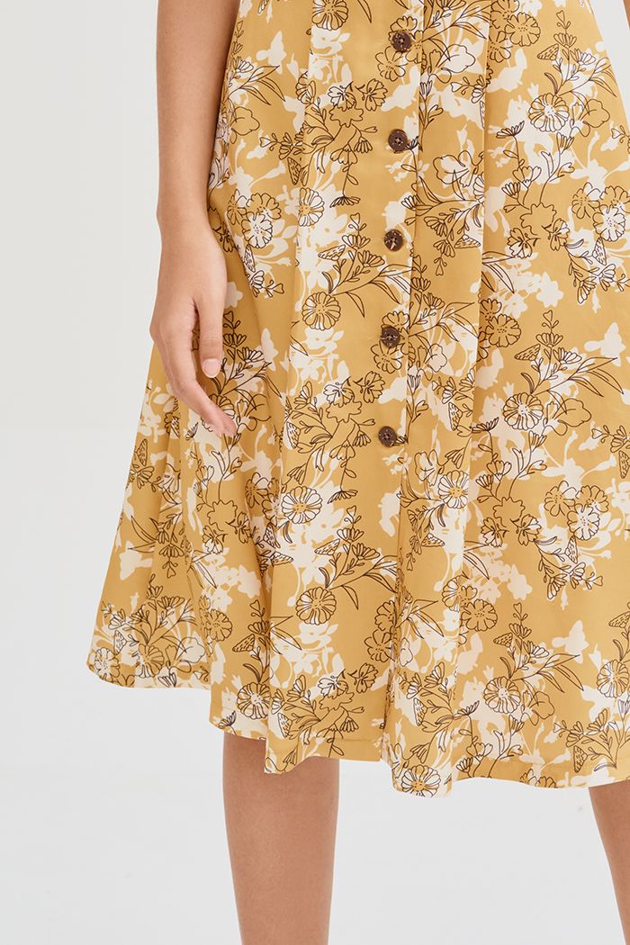 Đầm midi nẹp nút in hoạ tiết ss19 tay lỡ