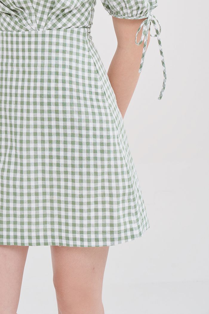Đầm caro chéo ngực xếp li tay lở viền