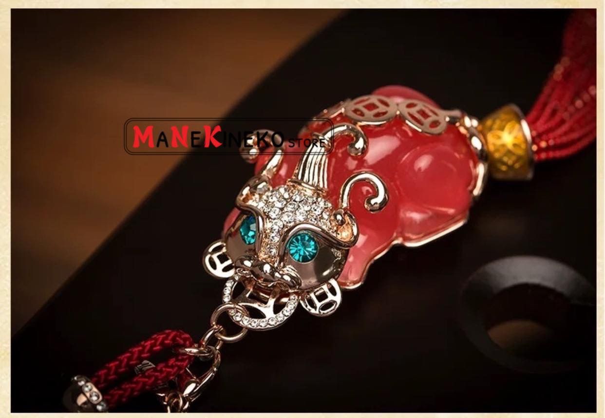 Móc treo xe tì hưu hồng ngọc