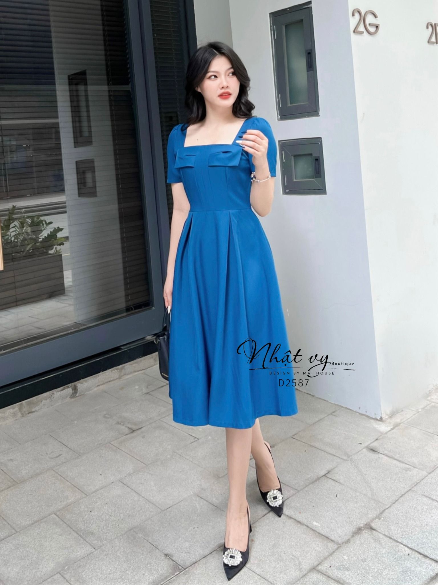 Đầm cổ vuông dáng xoè ngực đính nơ cách điệu - D2587
