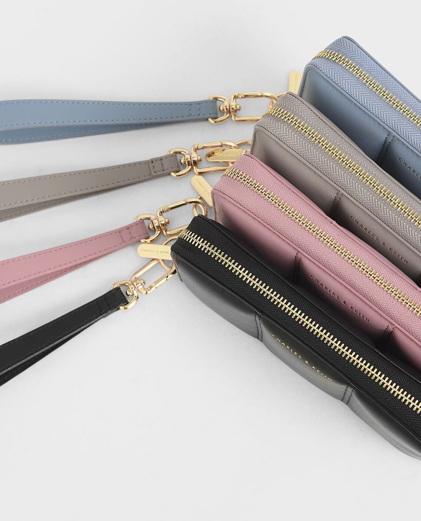 CHARLES & KEITH - Ví cầm tay nữ chữ nhật Mini Zip Around Quilted Tassel