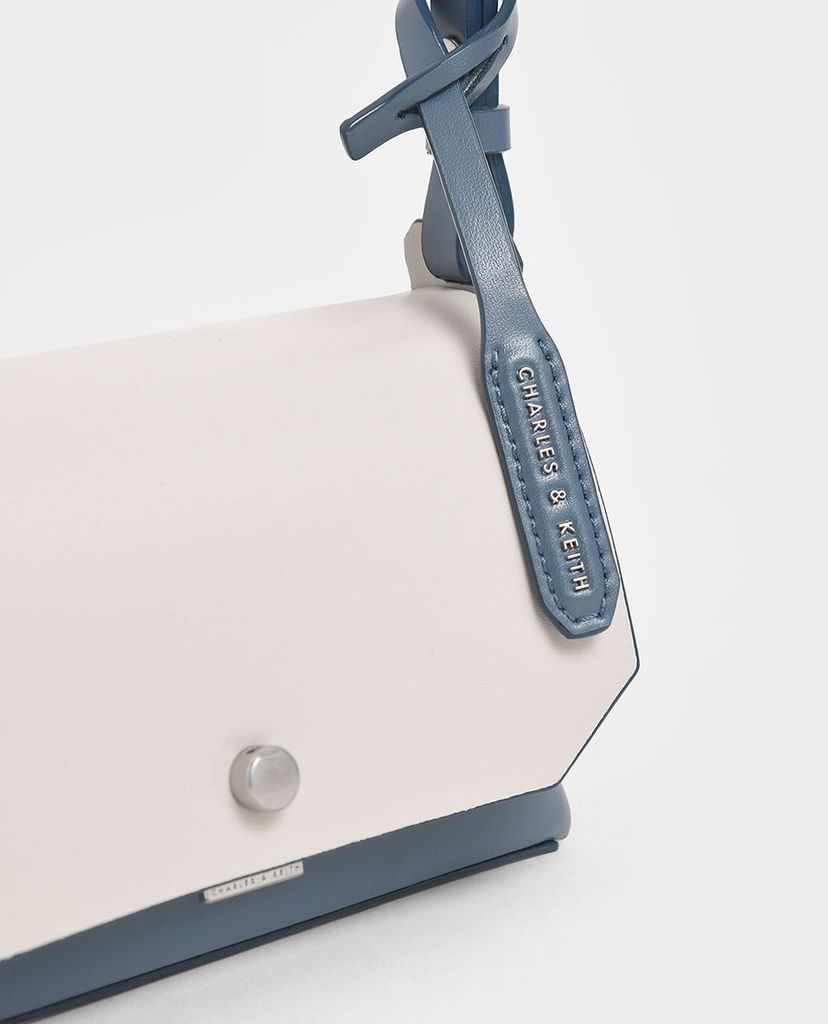CHARLES & KEITH - Túi đeo chéo chữ nhật Mini Reversible Front Flap