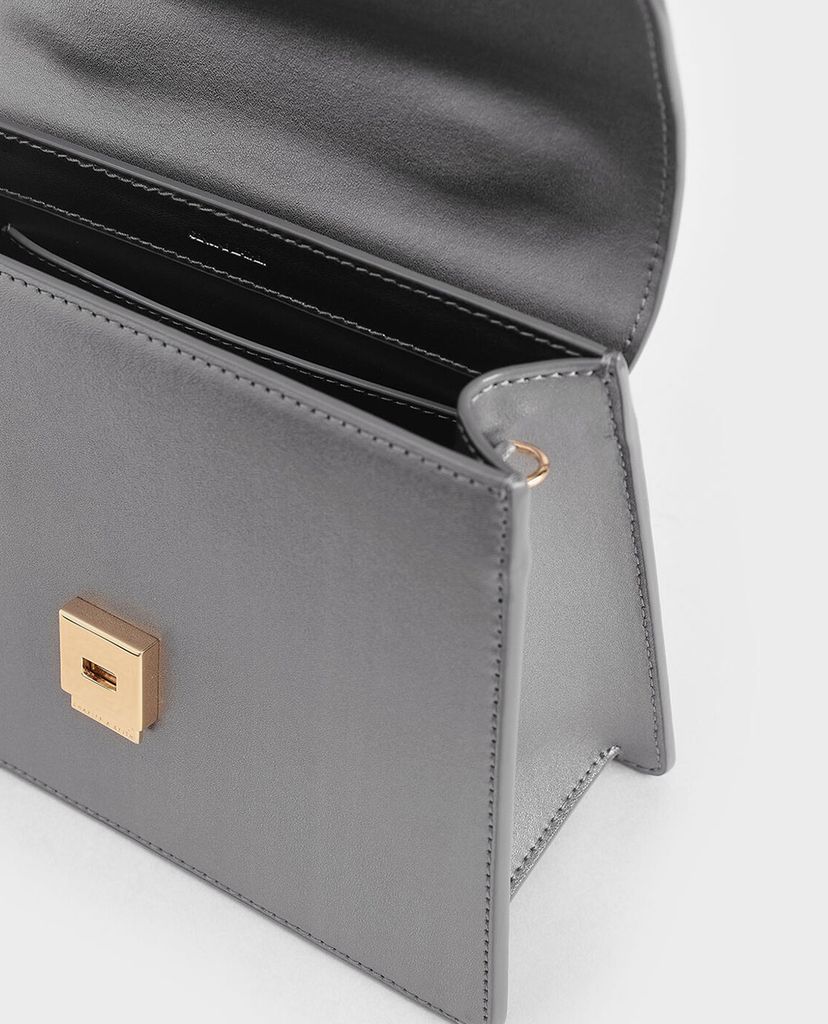 CHARLES & KEITH - Túi xách tay hình thang Leather Metallic Accent