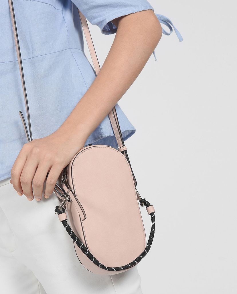 CHARLES & KEITH - Túi đeo chéo nữ hình bầu dục Rope Detail