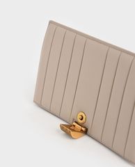 CHARLES & KEITH - Ví cầm tay nữ nắp gập Panelled Metallic Push Lock