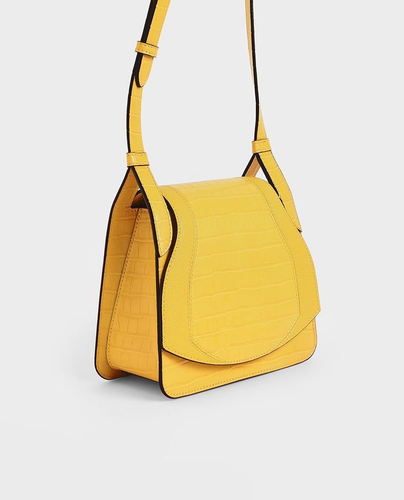 CHARLES & KEITH - Túi đeo chéo nữ hình thang Croc Effect