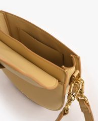 CHARLES & KEITH - Túi đeo vai nữ Metallic Buckle Saddle