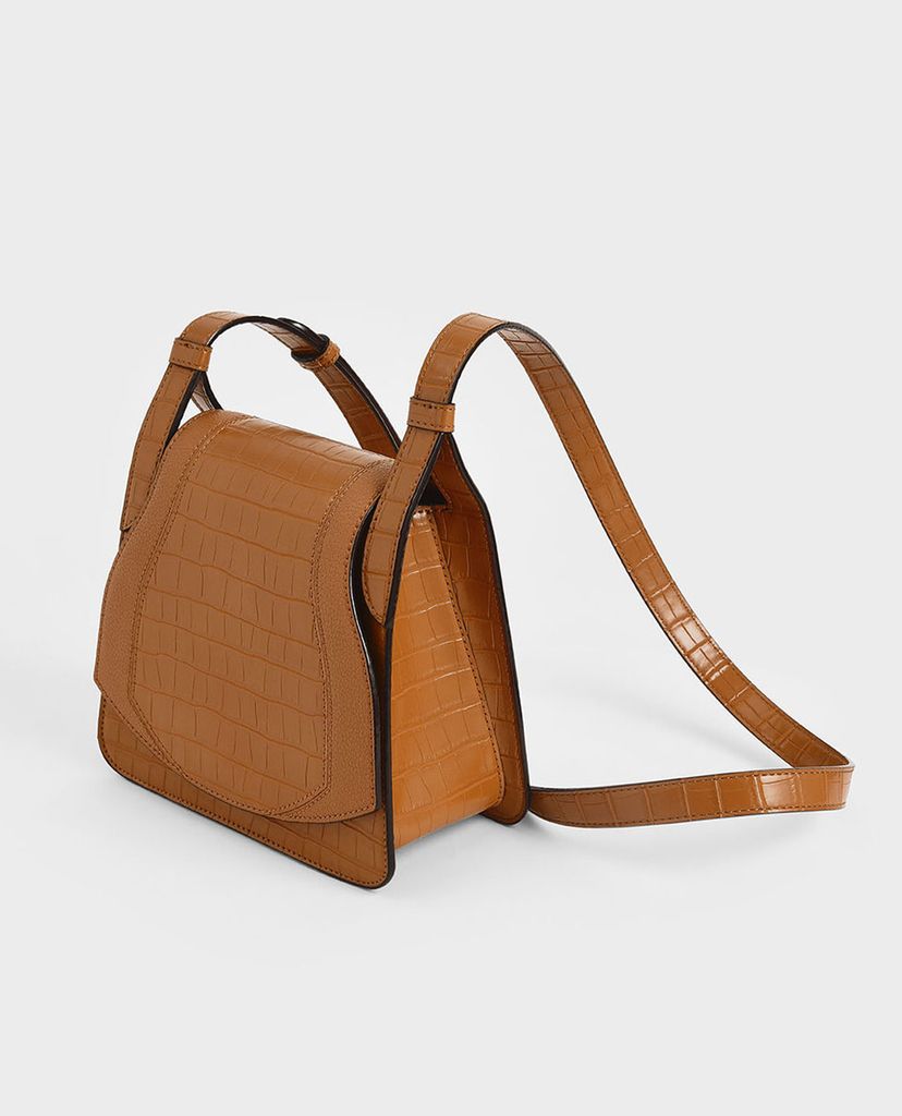 CHARLES & KEITH - Túi đeo chéo nữ hình thang Croc Effect