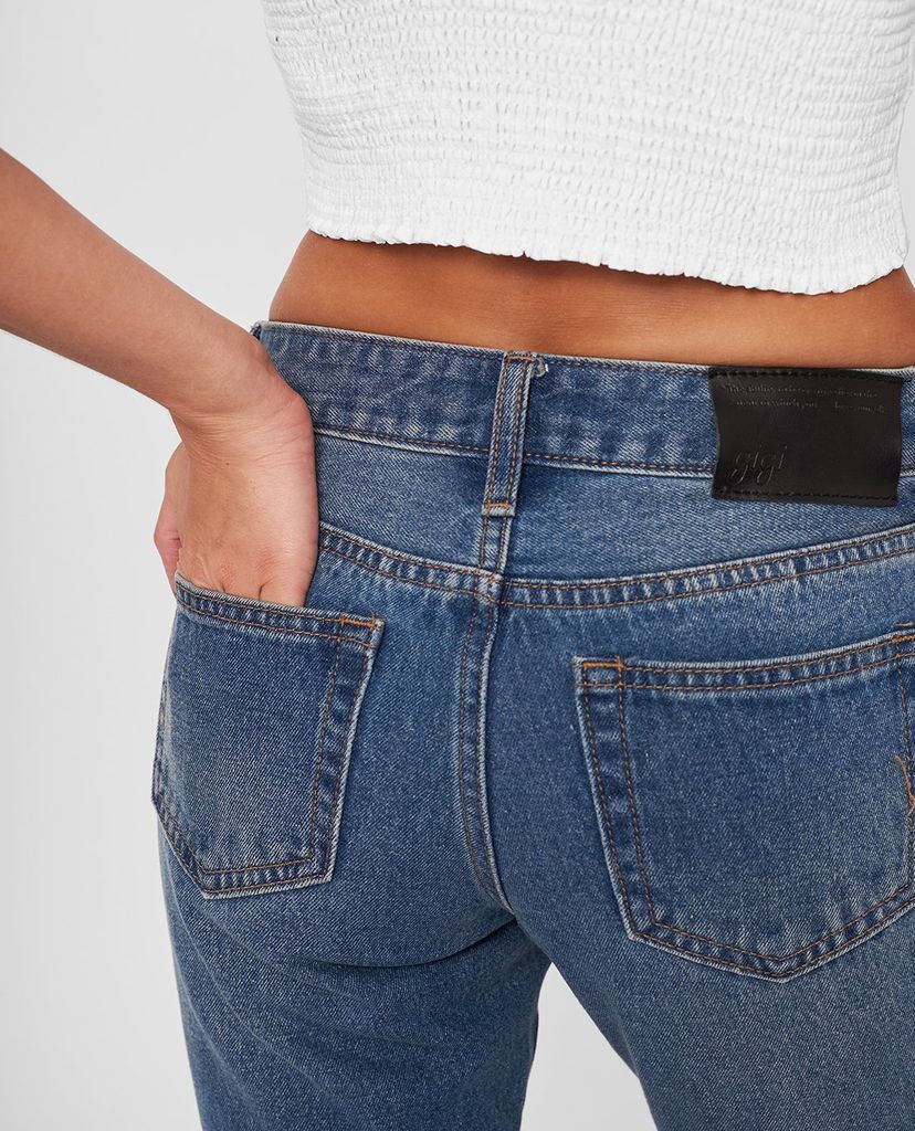 GIGI - Quần jeans nữ ống loe rách gối thời trang