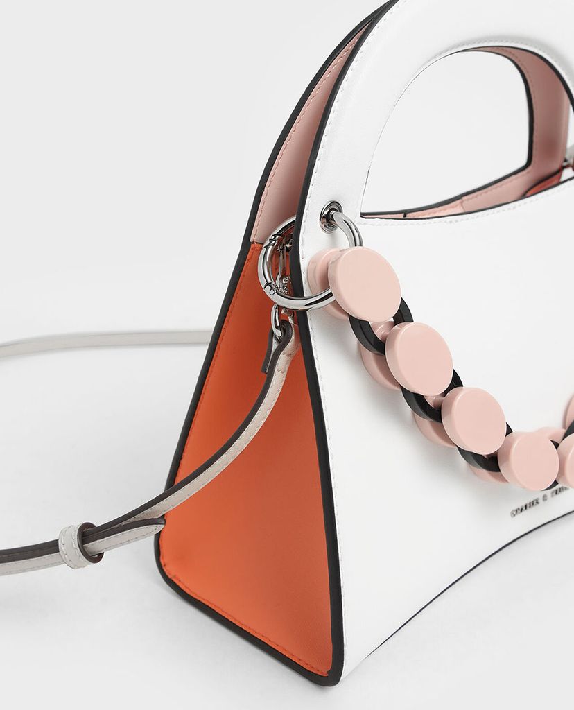 CHARLES & KEITH - Túi xách tay hình thang Acrylic Top Handle Sculptural