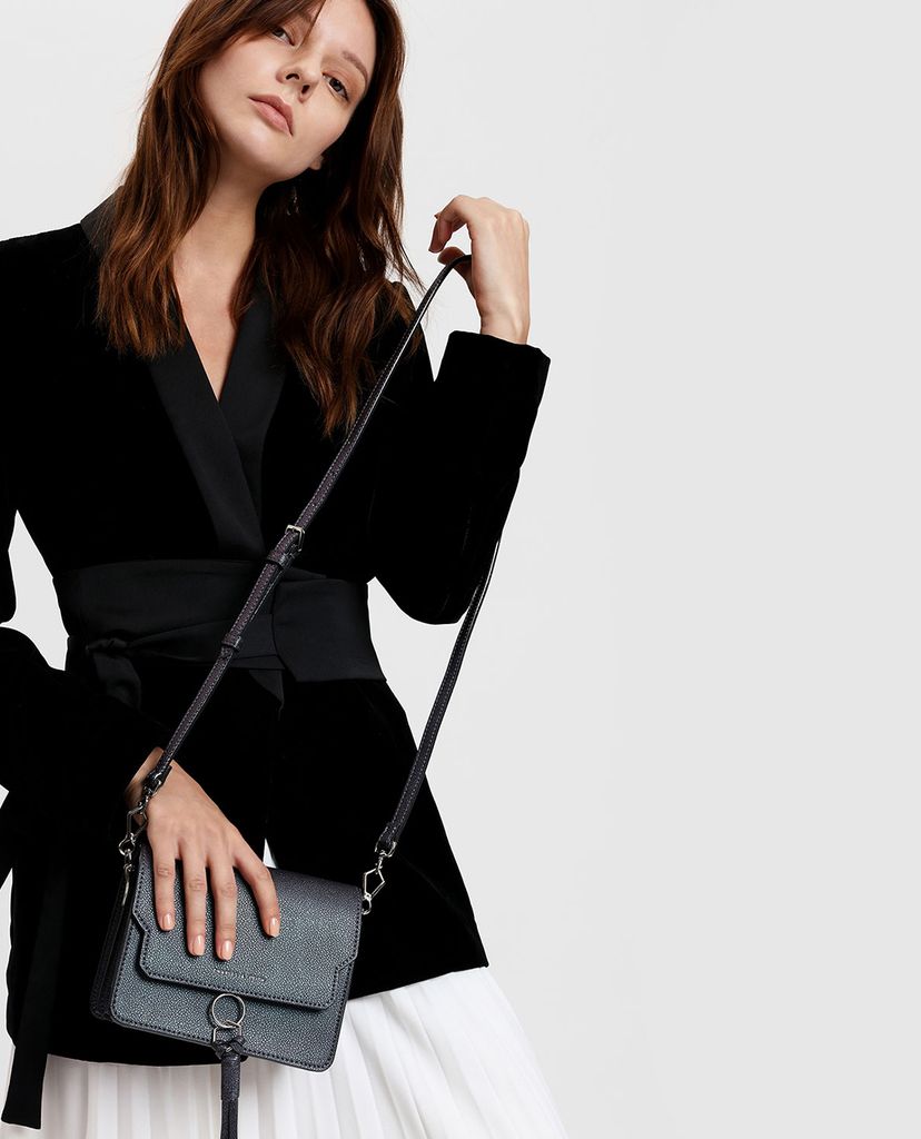 CHARLES & KEITH - Túi đeo chéo nữ chữ nhật phối chi tiết tua rua