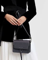 CHARLES & KEITH - Túi đeo chéo nữ chữ nhật phối chi tiết tua rua