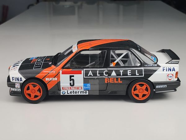 Xe mô hình BMW E30 M3 Group a - Rallye Ypres 1990 1:18 Solido (Đen sọc cam)