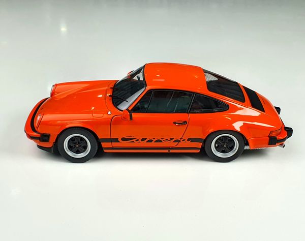 Xe mô hình Porsche 911 3.0 Carrera Orange 1977 1:18 Solido (Cam)