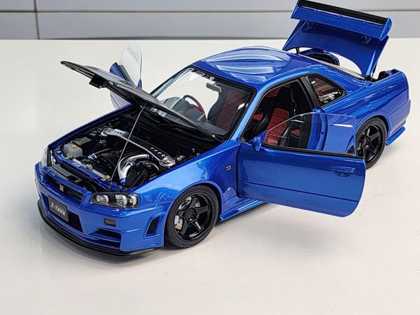 Xe Mô Hình NISMO R34 GT-R Z-tune 1:18 AUTOart ( BAYSIDE BLUE W/ CARBON BONN... )