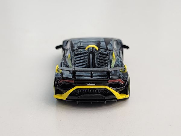 Xe Mô Hình Lamborghini Huracan STO Nero Noctis LHD 1:64 MiniGT ( Đen Viền Vàng )