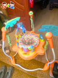 Ghế nhảy Jumperoo Rainforest màu cam, chân cong