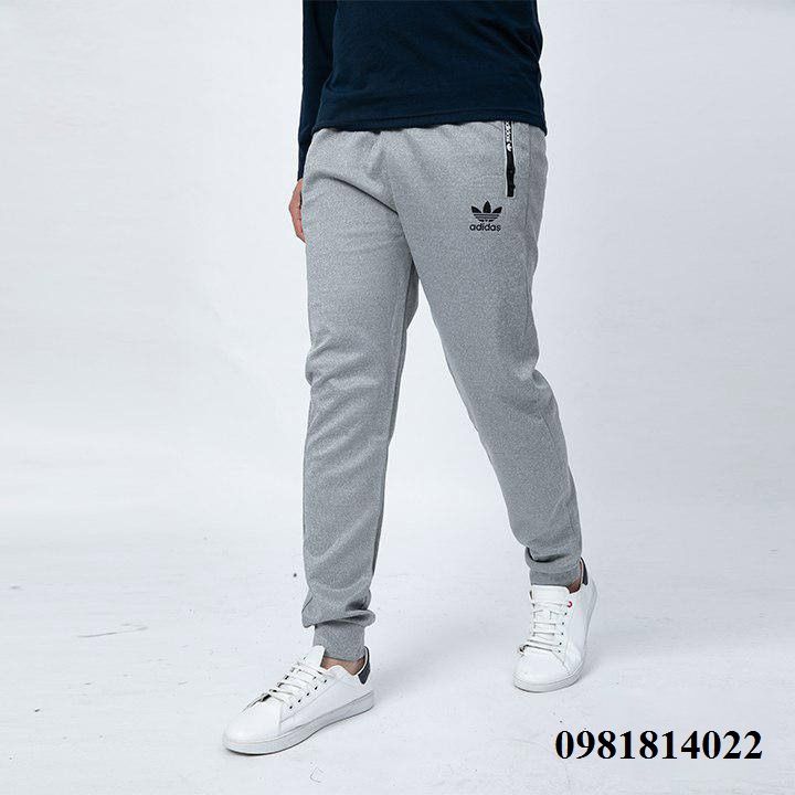 Quần thể thao khóa kéo in chữ Nike