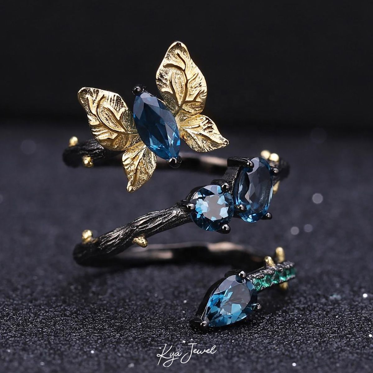 Nhẫn bướm đá Topaz xanh dương đậm