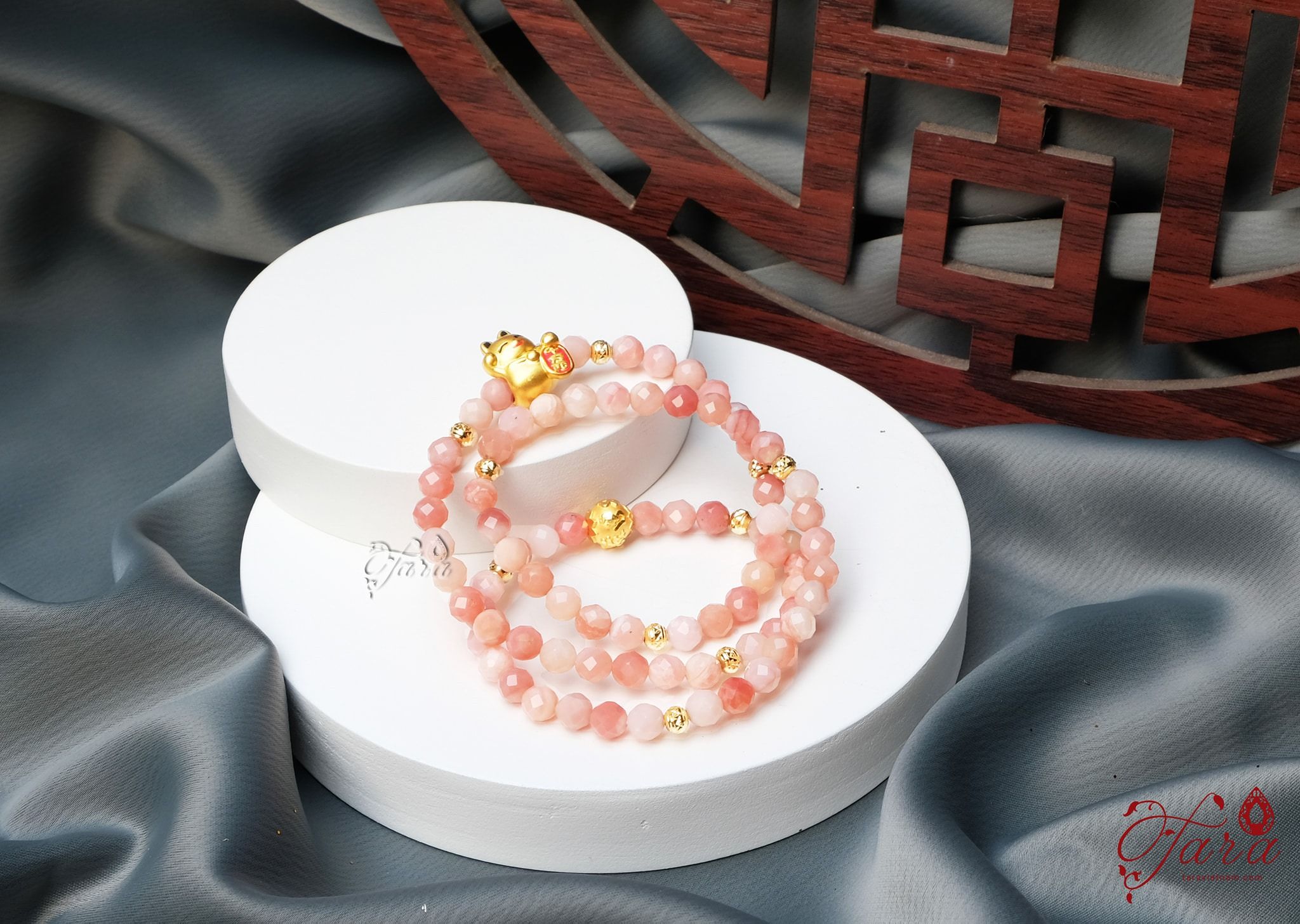 Chuỗi đá đào hoa mix charm vàng tài lộc 24k