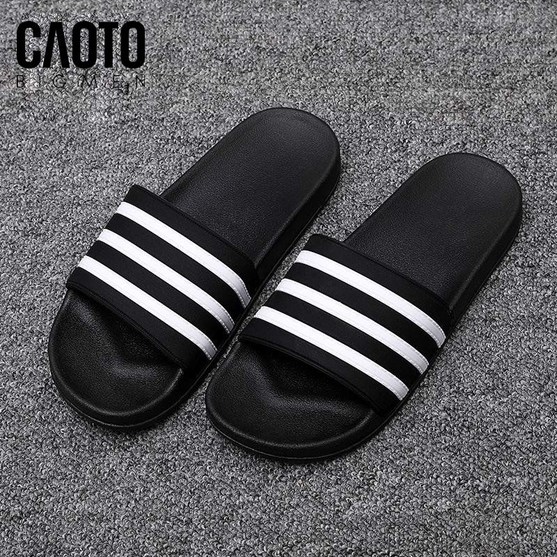 Dép Adidas trắng sọc đen