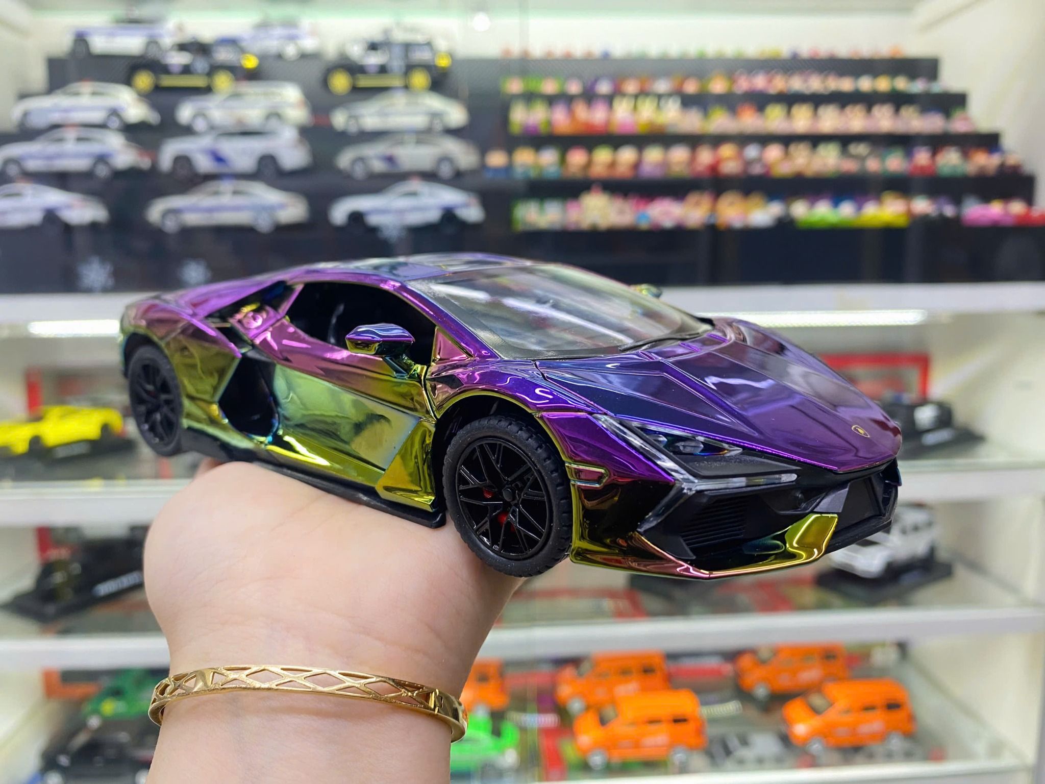 Mô hình xe Lamborghini Revuelto chrome color đánh lái được - full open - có đèn - âm thanh tỉ lệ 1:24 Alloy model OT24063