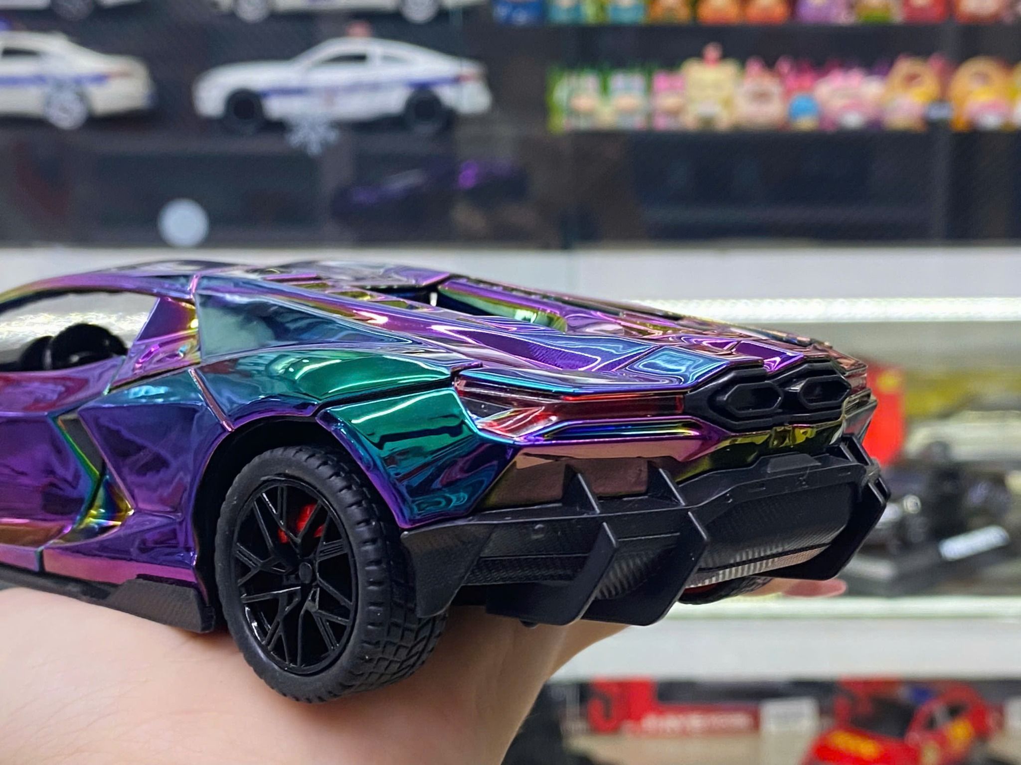 Mô hình xe Lamborghini Revuelto chrome color đánh lái được - full open - có đèn - âm thanh tỉ lệ 1:24 Alloy model OT24063