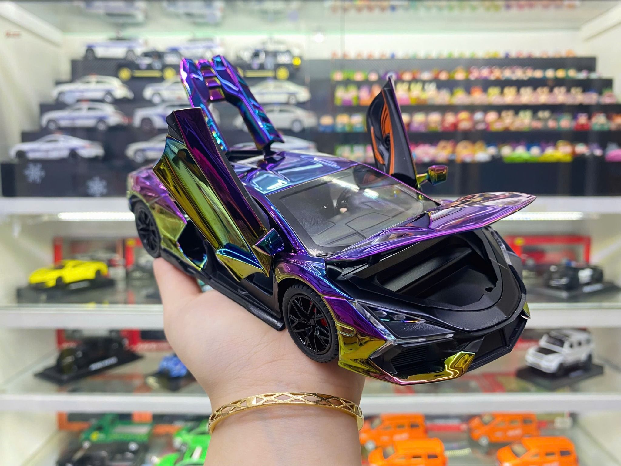 Mô hình xe Lamborghini Revuelto chrome color đánh lái được - full open - có đèn - âm thanh tỉ lệ 1:24 Alloy model OT24063