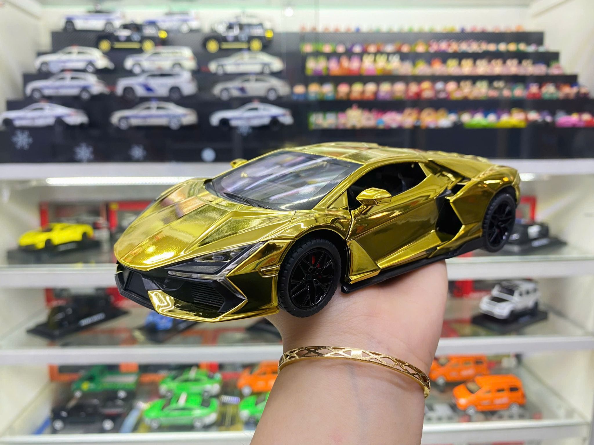 Mô hình xe Lamborghini Revuelto chrome color đánh lái được - full open - có đèn - âm thanh tỉ lệ 1:24 Alloy model OT24063