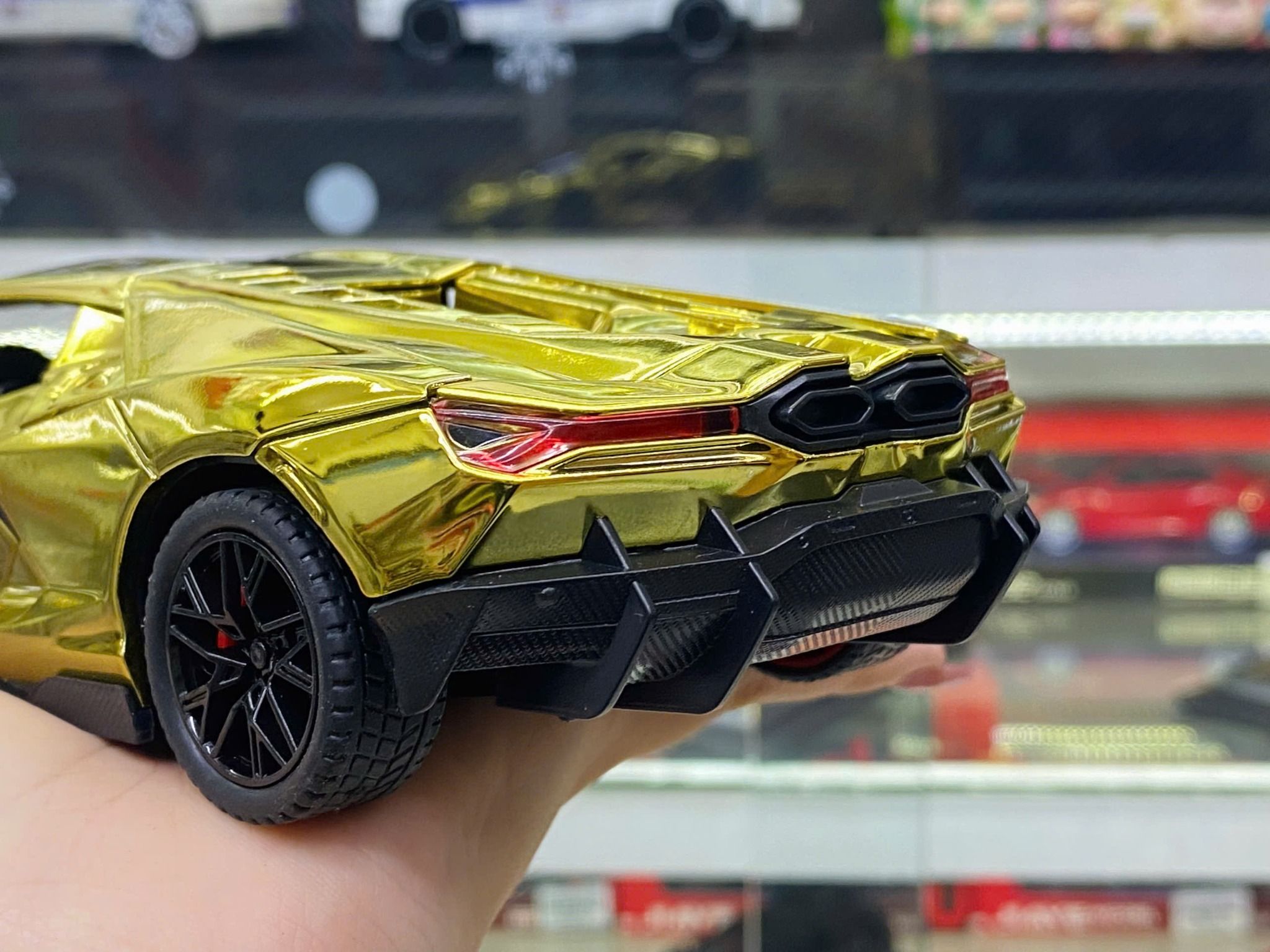 Mô hình xe Lamborghini Revuelto chrome color đánh lái được - full open - có đèn - âm thanh tỉ lệ 1:24 Alloy model OT24063