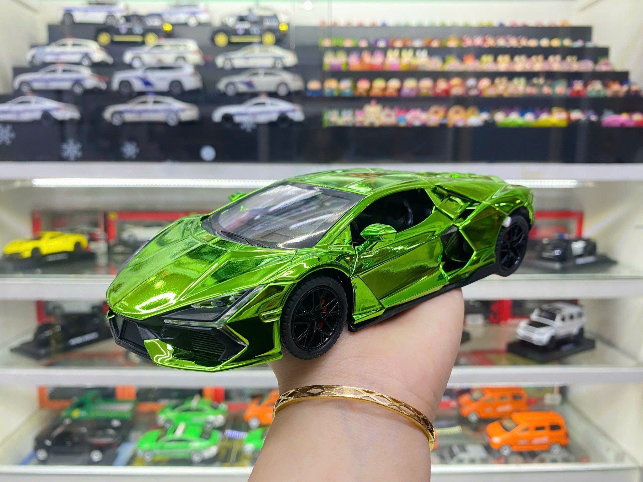 Mô hình xe Lamborghini Revuelto chrome color đánh lái được - full open - có đèn - âm thanh tỉ lệ 1:24 Alloy model OT24063