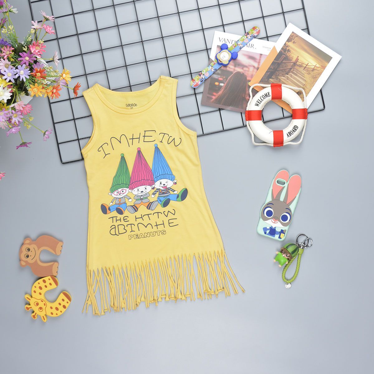 Đầm sát nách chân váy tua rua bohemian cho bé gái