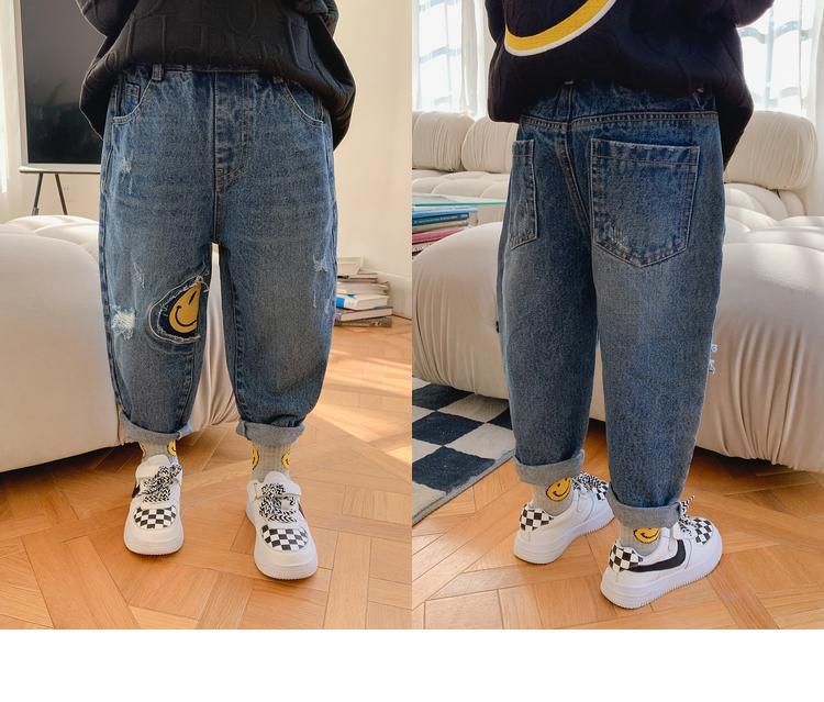 Quần jean trẻ em wash rách in hinh icon mặt cười