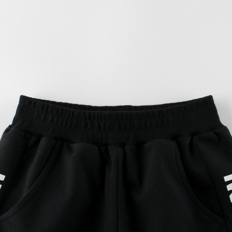 Quần thun bé trai 27KIDS, quần short thun cho bé trai thể thao phối chữ bên hông