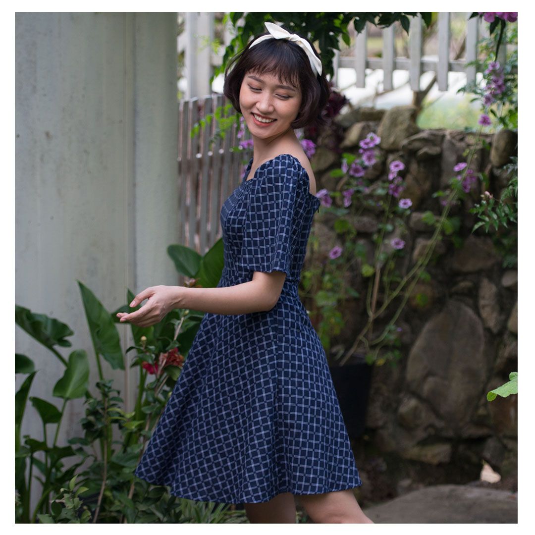 bell-sleeve dress in navy with plaid